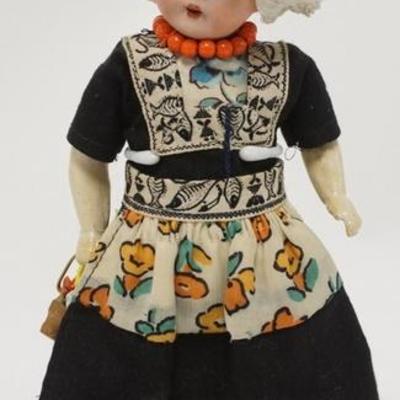 1306	GERMAN BISQUE HEAD DOLL W/ STAND 9 1/4 IN H 
