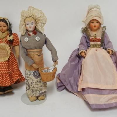 1309	GROUP OF THREE DOLLS ONE IS BISQUE HEAD LARGEST IS 10 IN 
