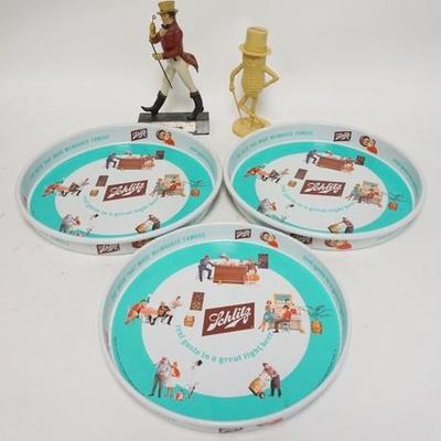 1316	FIVE PIECE ADVERTISING LOT, JOHNNY WALKER FIGURE, MR. PEANUT BANK & THREE SCHLITZ TRAYS, LARGEST TRAY IS 13 1/4 IN 
