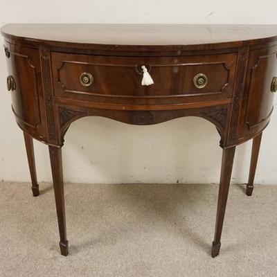 1100	ANTIQUE MAHOGANY DEMILUNE SERVER HAS ONE DRAWER TWO DOORS REEDED LEGS & BANDED TOP, 50 3/4 IN W, 37 IN H 
