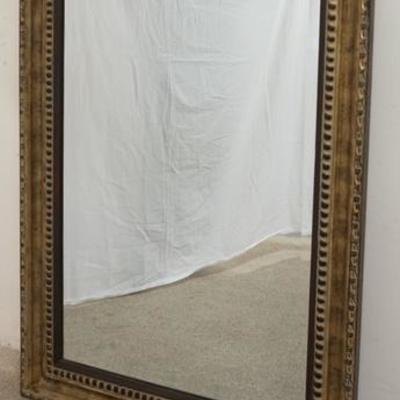 1293	LARGE BEVELED MIRROR IN A CARVED FRAME, OVERALL DIMENSIONS 30 1/2 IN X 42 1/2 IN 
