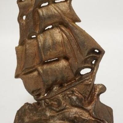 1191	CAST IRON SAILING SHIP DOOR STOP, HAS IMPRESSED NAME ON THE BACK ILLEGIBLE, 9 1/4 IN H 
