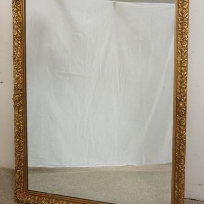 1287	LARGE MIRROR IN FLORAL GILT FRAME, WIRED TO HANG HORIZONTAL OR VERTICAL OVERALL DIMENSIONS 41 IN X 53 1/2 IN 
