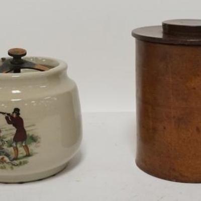 1131	TWO HUMIDORS, ONE IS GRAYS POTTERY W/ HUNTING SCENE, THE OTHER IS LEATHER W/ A GLASS LINER, TALLEST IS 6 1/4 IN 
