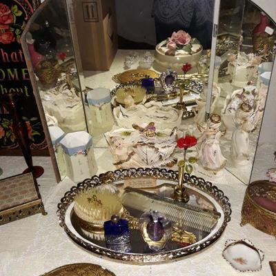 Several Hollywood Regency dresser pieces.