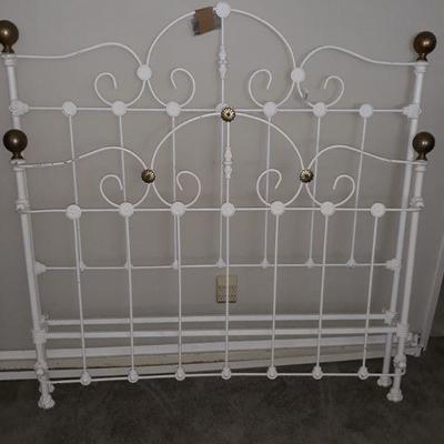 Antique painted cast iron bed (full size) with brass finials.