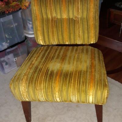 mid-century chair that just needs new upholstery fabric to make it very current.