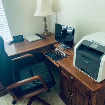 Office desk, chair, computer and printer