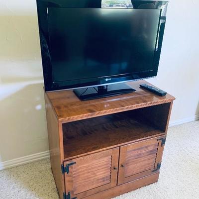 Flat screen television and nightstand
