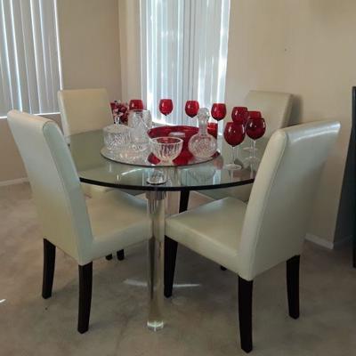 MID CENTURY Round glass dining table w Lucite legs  4 Leather chairs.  