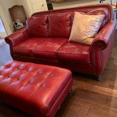 red leather couch with matching ottoman and chairs 