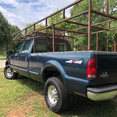 Lot # 40  $5500 ~ Ford F250 '99  4X4 - 4 wheel drive/285K miles  Hide Away hitch and Gooseneck hitch  with work racks  (sorry TRUCK not...