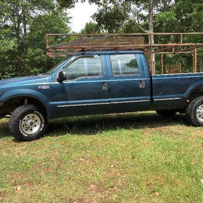 Lot # 40  $5500 ~Ford F250 '99  4X4 - 4 wheel drive/285K miles  Hide Away hitch and Gooseneck hitch  with work racks (sorry TRUCK not...