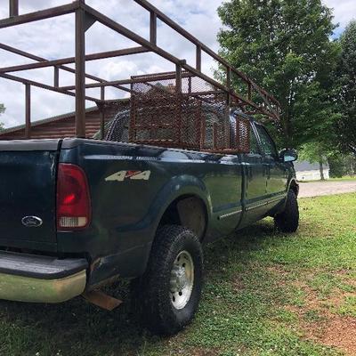 Lot # 40  $5500 ~ Ford F250 '99  4X4 - 4 wheel drive/285K miles  Hide Away hitch and Gooseneck hitch  with work racks (sorry TRUCK not...