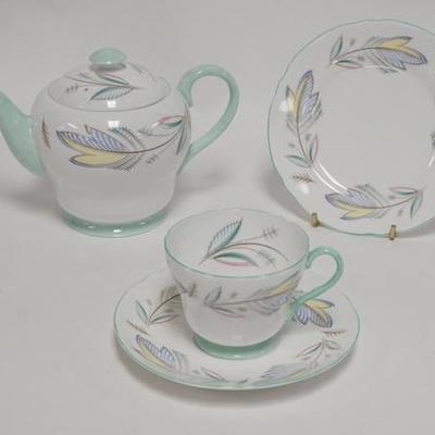 1082	FOUR PIECES OF SHELLEY W/ A LEAF DESIGN, TEAPOT, CUP & SAUCER & A 6 IN PLATE, TEAPOT IS 5 1/8 IN H 
