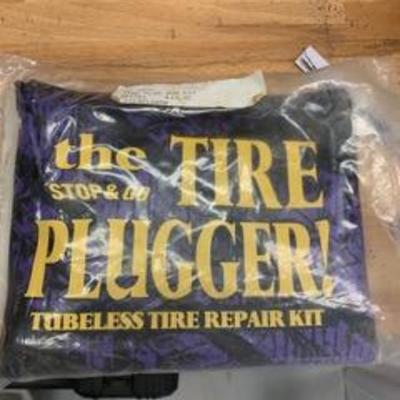 tire repair kits (a pump and tire fixer) for motorcyclists. Never used (fortunately) $20