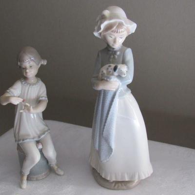 Lladro- one has a little damage