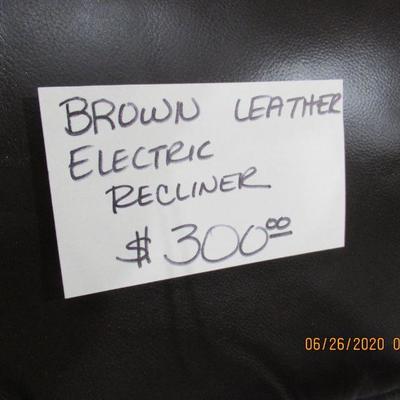 Brown Leather electric operated recliner $300.00/ like new. 