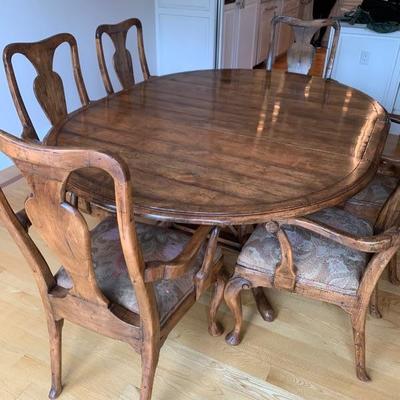 2800$ GUY Chaddock distressed walnut dinning room set.  It is 54 inches in diameter with two 18 inch leaves. 