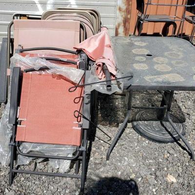 20020	

Outdoor Glass Table, 4 Foldable Outdoor Chairs, 6 Foldable Chairs, and 1 Foldable Table
Glass Table Measures Approx 40