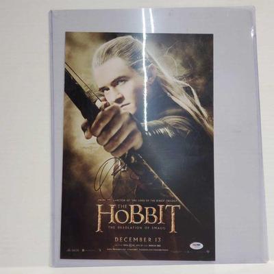 2234	

The Hobit Moive Poster Signed By Orlando Bloom- With COA
Size: 12Ã—18
