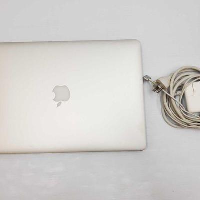1900	

Mac Book Pro, With Charger- 14