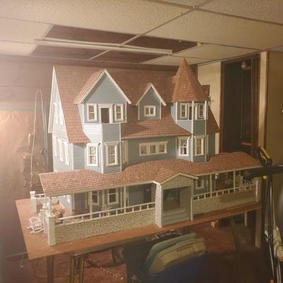 This fully furnished, electrified dollhouse is over five feet wide and four feet tall! The next dozen photos are of the interior rooms.