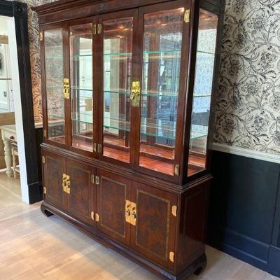 Drexel Heritage Ming Treasures collection china display cabinet with same carved design on lower doors. Interior lighting for glass...