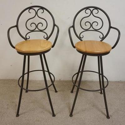 1028	PAIR OF IRON SWIVEL BAR CHAIRS WITH WOODEN SEATS. 45 1/4 IN HIGH
