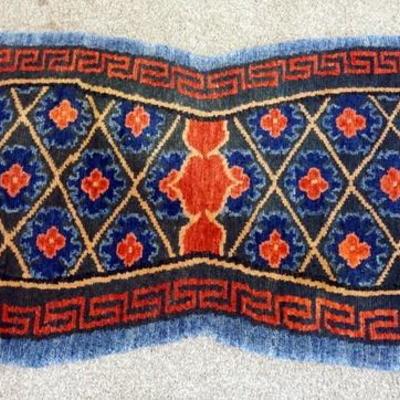 1079	RED AND BLUE SADDLE RUG, 4 FT 1 IN X 2 FT 1 IN.
