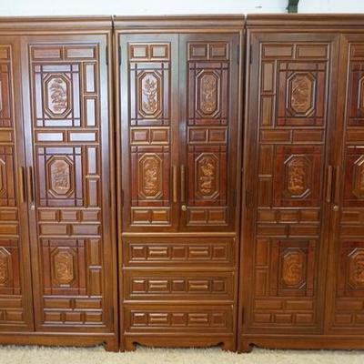 1058	KOREAN 3 SECTION CARVED ARMIORE, WITH 6 DOORS AND 3 DRAWERS. IT HAS CARVED PANELS WITH ANIMALS, 110 IN TOTAL WIDTH AND78 1/2 IN HIGH.
