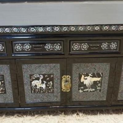 1019	BLACK LACQUER LOW CHEST WITH MOP INLAY OF BIRDS, ANIMALS AND FLOWERS. HAS DOORS AND DRAWERS. 39 1/2 IN WIDE, 19 IN HIGH
