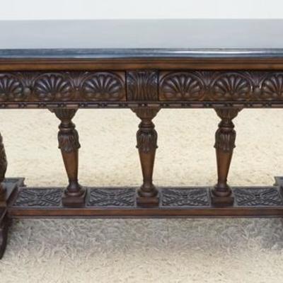 1024	HEAVILY CARVED SOFA TABLE WITH BLACK STONE TOP AND 2 DRAWERS. 72 IN X 22 IN, 32 1/2 IN HIGH
