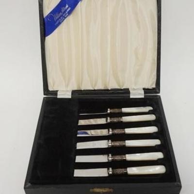 1004	SET OF 6 FISH KNIVES BY WILLIAM ADAMS SHEFFIELD ENGLAND IN ORIGINAL BOX. MOP HANDLES WITH STERLING SILVER COLLARS WITH STAINLESS...