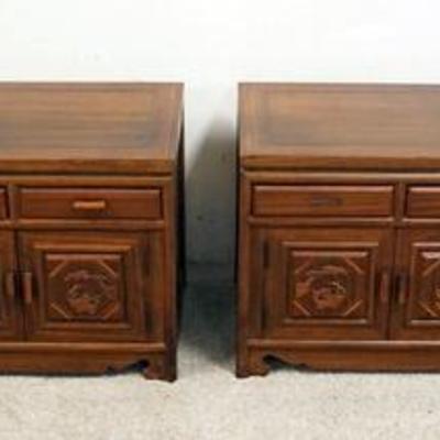 1067	PAIR OF KOREAN LOW CHESTS WITH CARVED PANELS ON THE DOORS. ONE DRAWER PULL IS MISSING ON EACH. 40 IN WIDE X 14 1/4 IN DEEP X 16 1/2...
