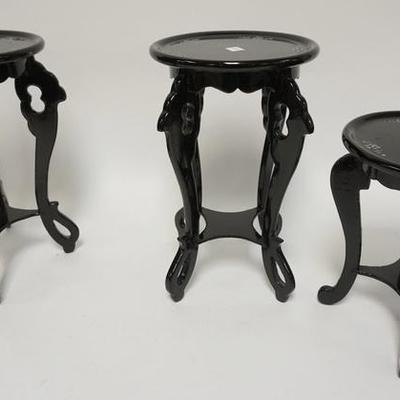 1051	3 SMALL BLACK LACQUER STANDS WITH MOP INLAY. TALLEST 12 2/4 IN. TOPS 7 1/2 -8 IN DIAMETER

