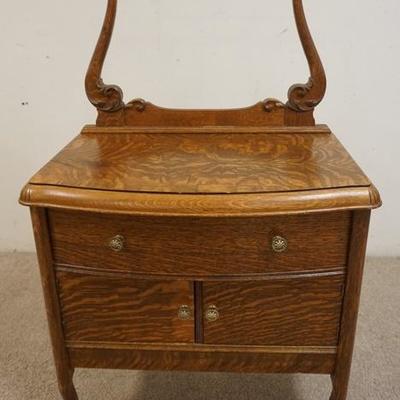 1038	OAK WASHSTAND WITH TOWEL BAR AND BOWED FRONT. 30 IN WIDE
