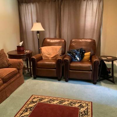 Leather recliners, three-cushion Sherrill sleeper sofa, round end table, hand-painted floor lamp, area rug.