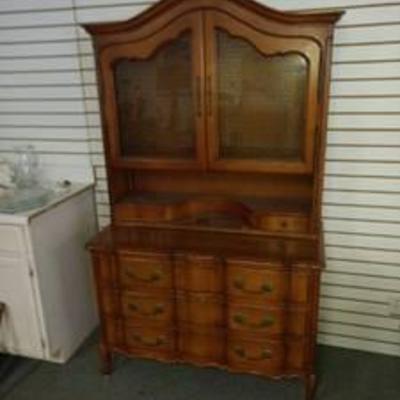 2 piece hutch with leather insert on top of bottom piece with key