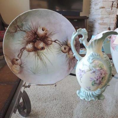 427	
Hand Painted Decorative Plate and Cracked Pitcher
Porcelain Hand Painted Pinecone Plate measures approx 11