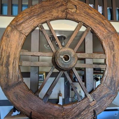 Wagon Wheel - wood. Rustic, good condition, great conversation piece. Approx 48 inch round. A must have! $250