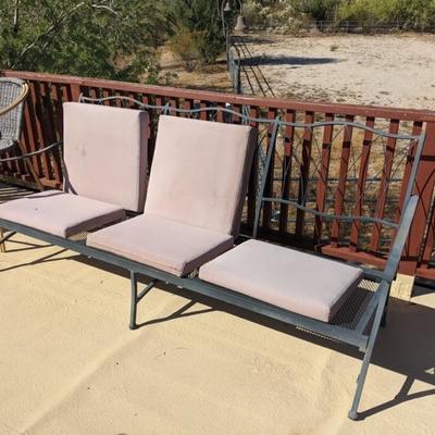 7 foot long wrought iron outdoor sofa, missing back cushion. Metal frame in good condition, cushions may need replacing $195