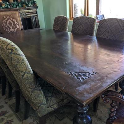 Dining table with 10 cloth covered chairs
94