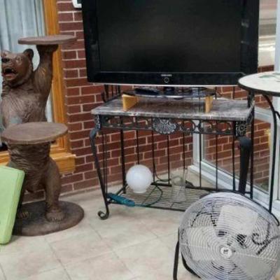 TV on iron table. Bear stand.