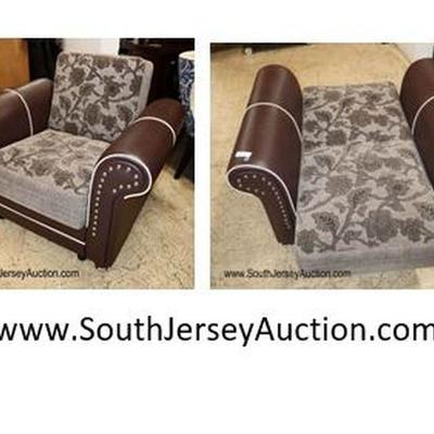 Lot: 646 - Newer modern design leather style and upholstered

Newer modern design leather style and upholstered convertible club chair...