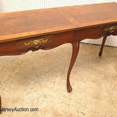 Lot: 611 - Burl walnut and banded 2 drawer console table by

Burl walnut and banded 2 drawer console table by Baker Furniture
