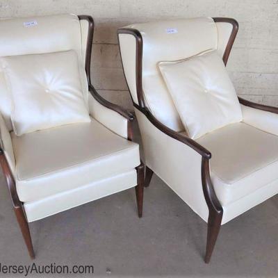 Lot: 449 - Pair of modern design mahogany cream leather style

Pair of modern design mahogany cream leather style fireside chairs - Very...