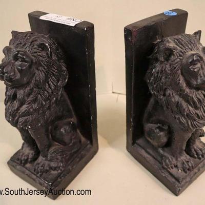 Lot: 557 - Pair of carved lion bookends in the composition

Pair of carved lion bookends in the composition
