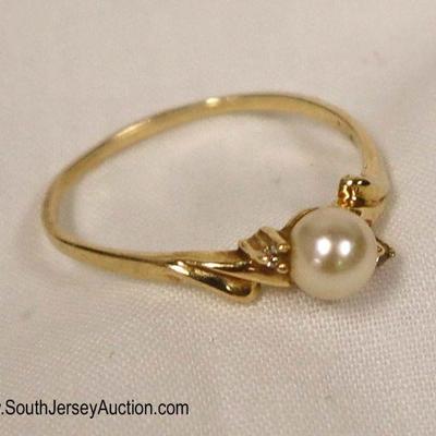 Lot: 497 - Marked 14 karat yellow gold pearl and tested

Marked 14 karat yellow gold pearl and tested diamond ring approximately 0.05 oz. t
