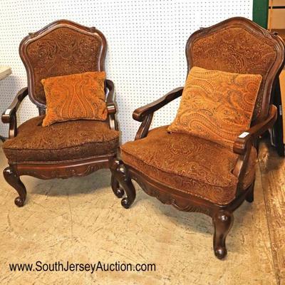 Lot: 716 - PAIR of mahogany frame upholstered decorative

PAIR of mahogany frame upholstered decorative carved arm chairs with pillows by...